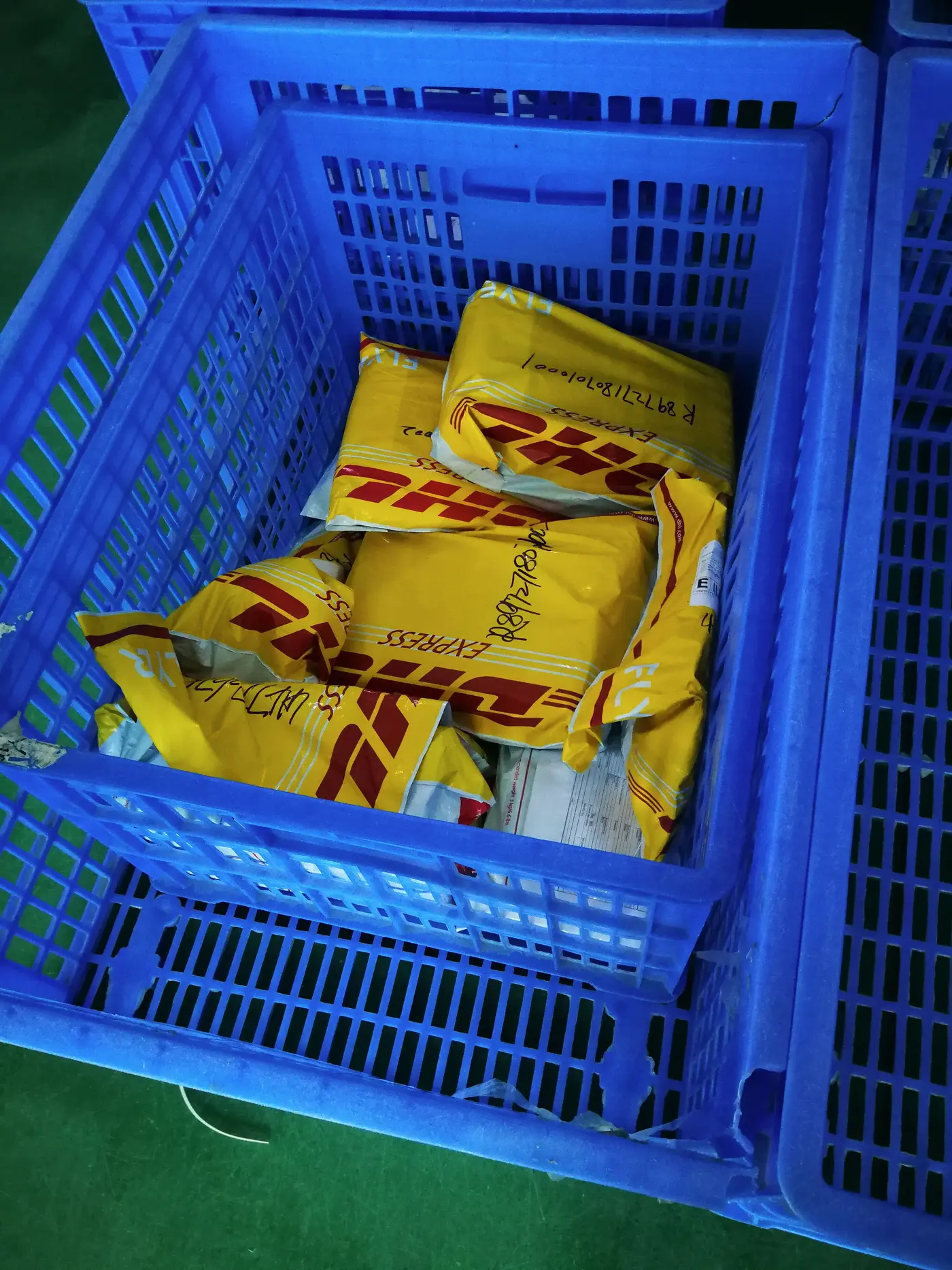 DHL Express bags in a crate at our Shenzhen warehouse, ready for collection