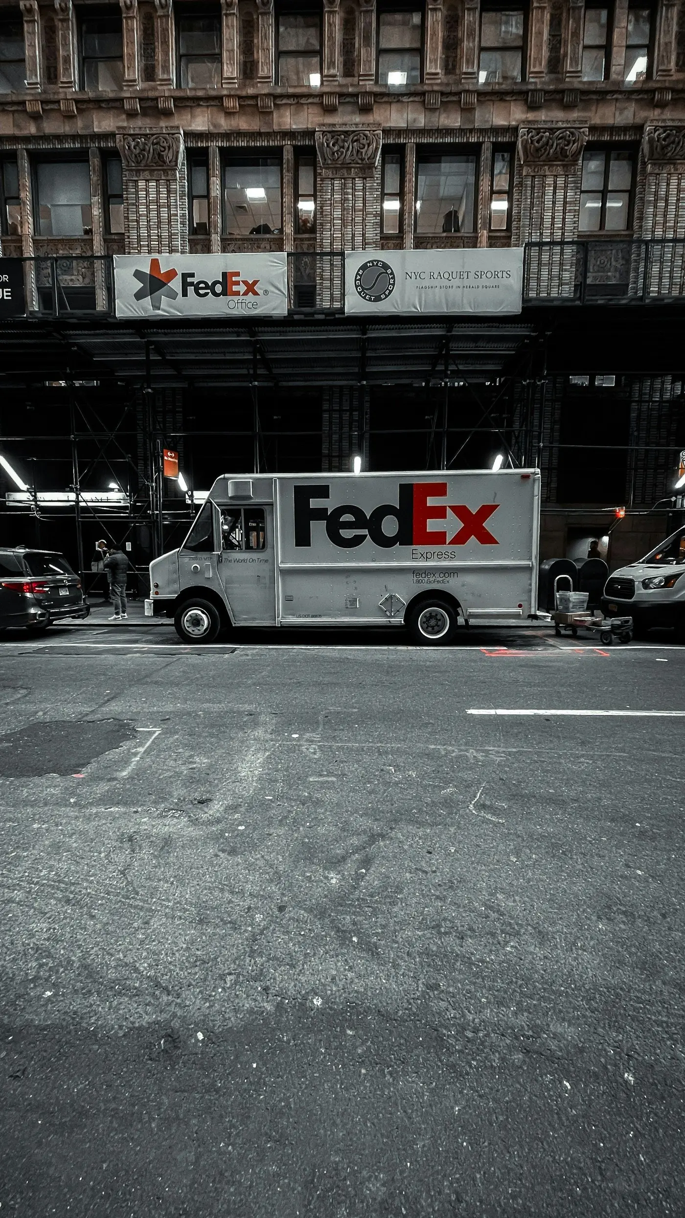 A FedEx Express truck in a parking lot