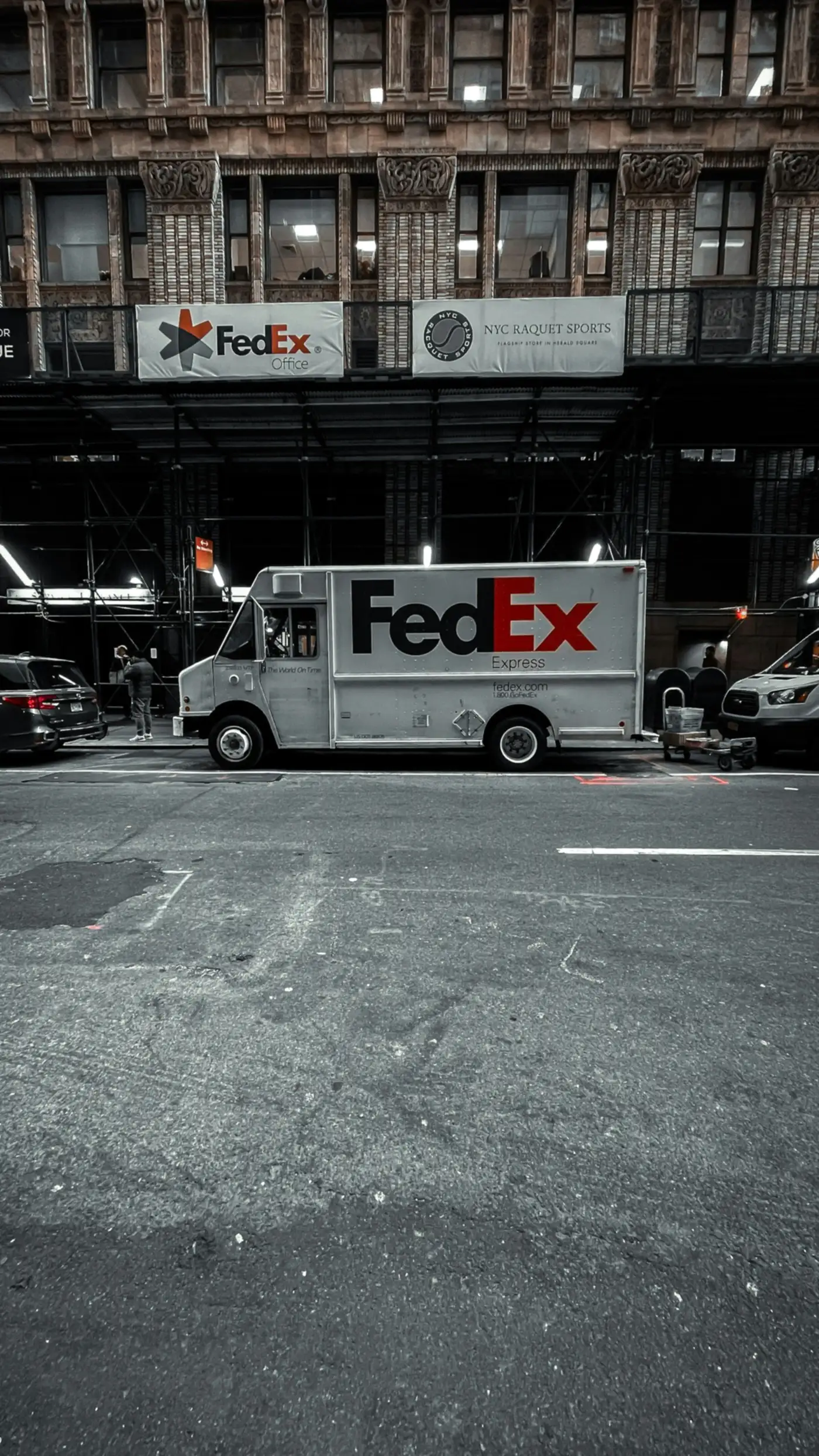 A FedEx Express truck in a parking lot