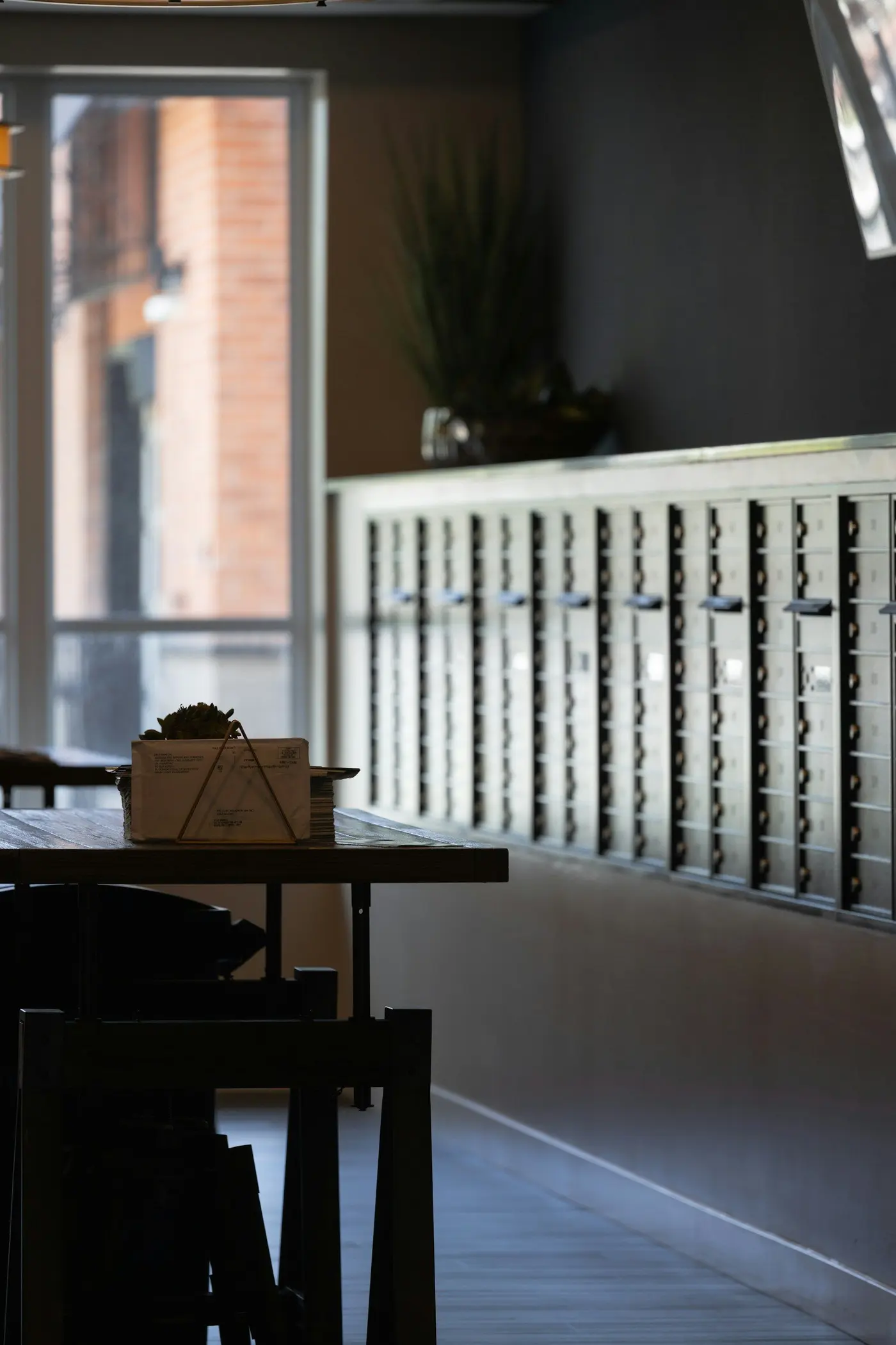A wall of mail boxes in a post room
