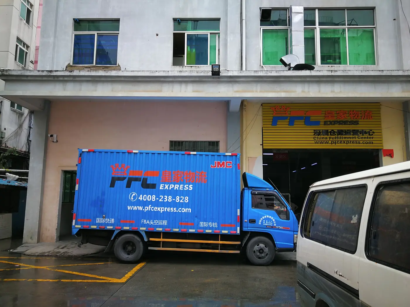 A PFC truck and a van at the door of our depot