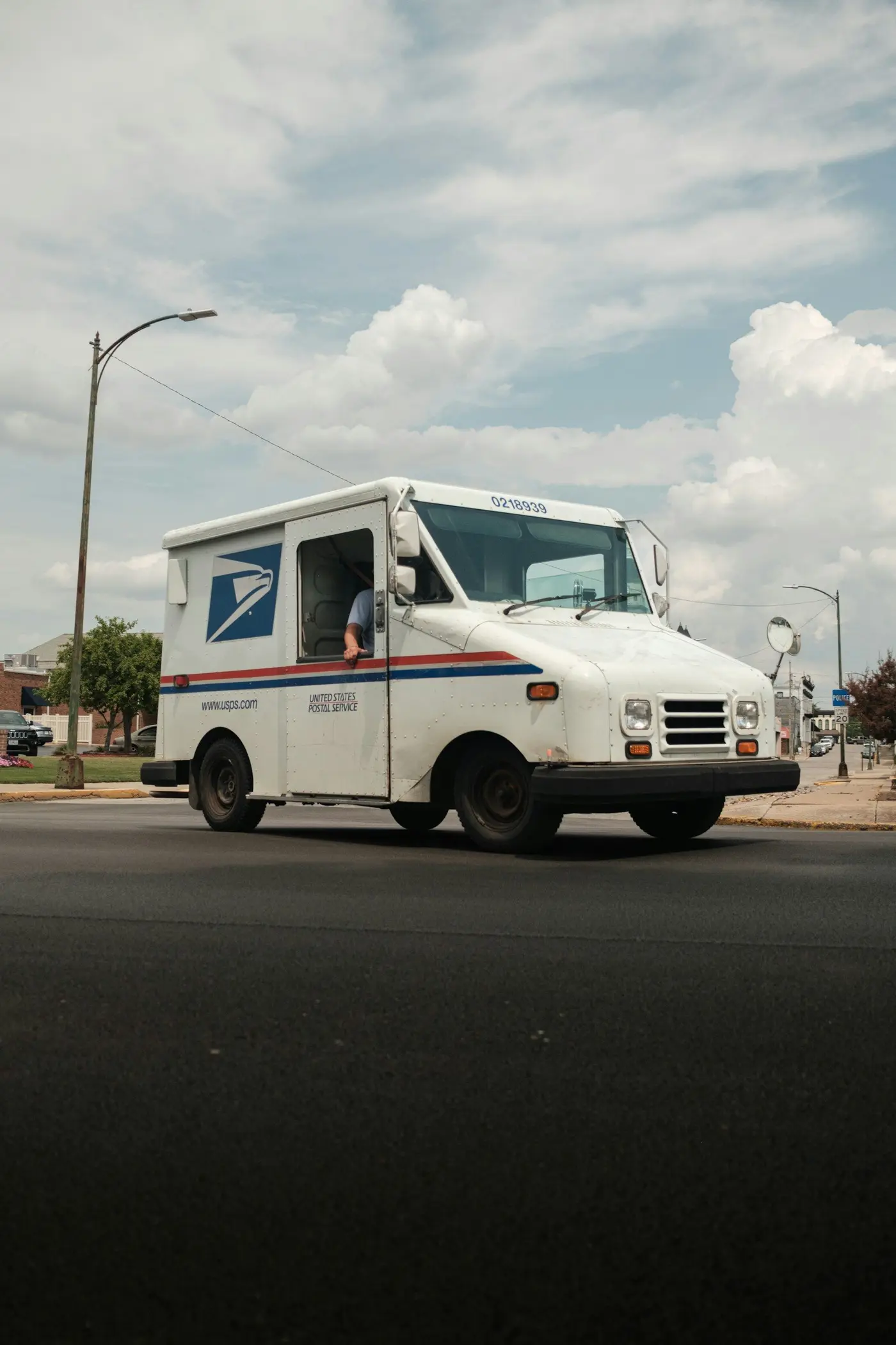 A United States Postal Service truck on a city street